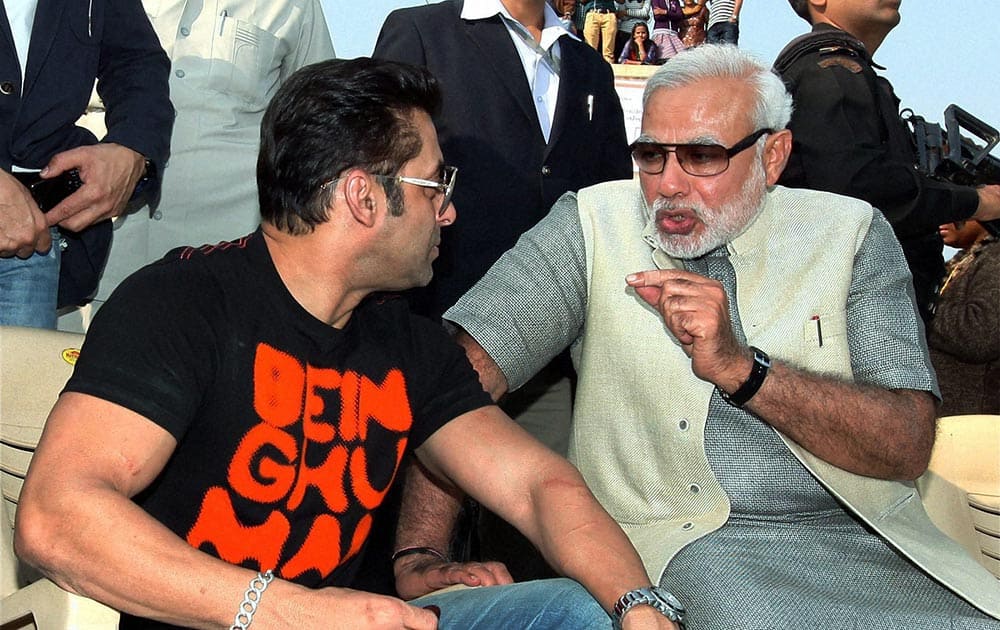 Gujarat Chief Minister and BJP`s PM candidate Narendra Modi with Bollywood actor Salman Khan during the Uttarayan Festival in Ahmedabad.