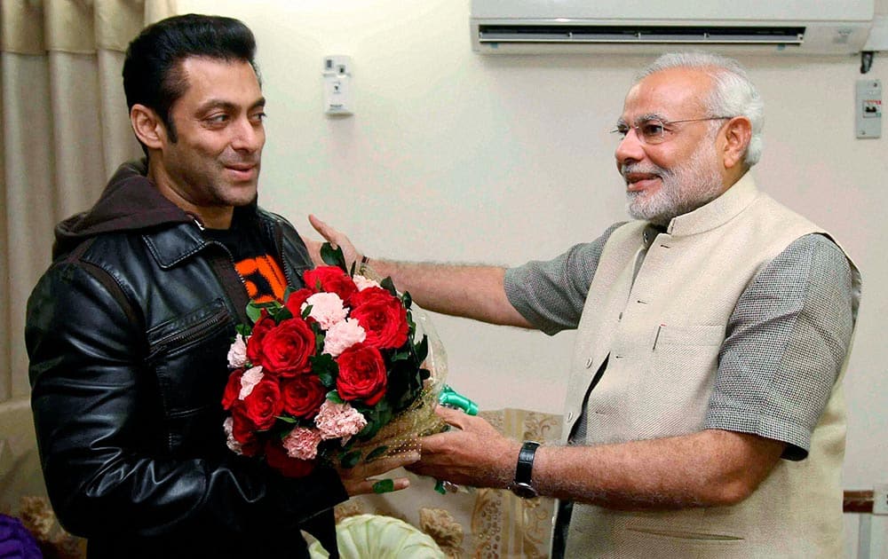 Gujarat Chief Minister and BJP`s PM candidate Narendra Modi with Bollywood actor Salman Khan during a meeting in Ahmedabad.