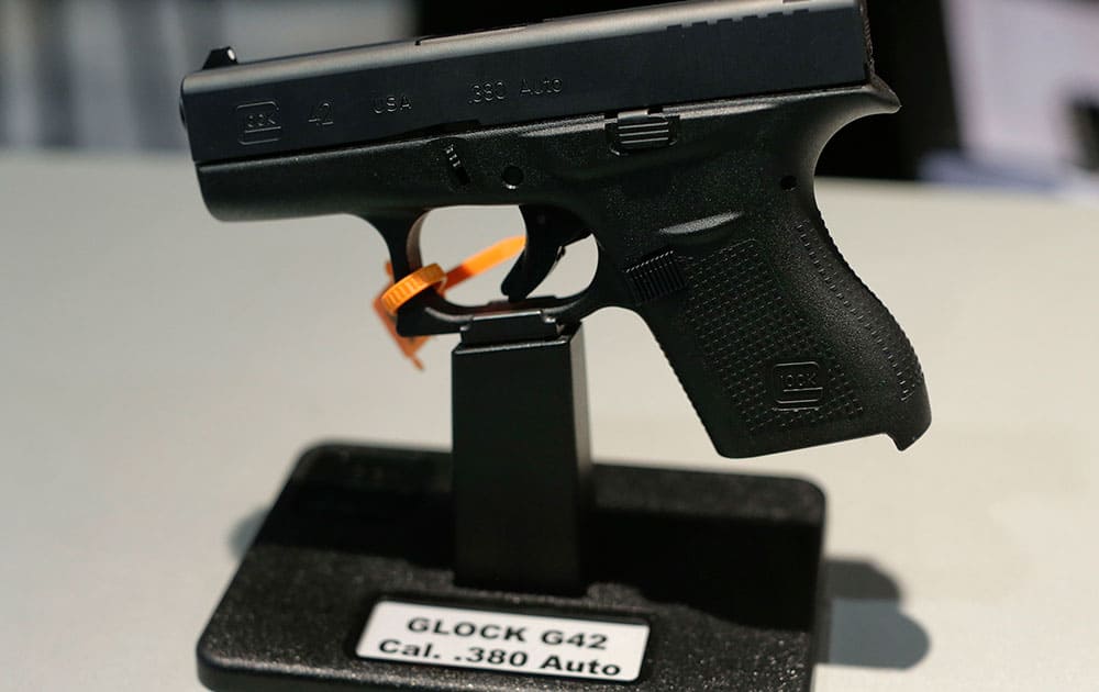 The Glock G42, .380 caliber Auto hand gun sits on display at the Glock display booth during the Shooting Hunting and Outdoor Trade Show, in Las Vegas.