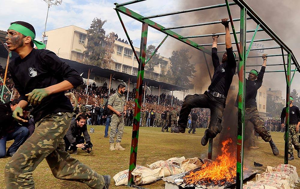 Palestinian high school students demonstrate skills they learned in a Hamas-run military training program during a graduation ceremony in Gaza City.