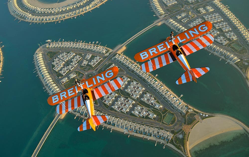 The Breitling Wingwalkers fly over Durrat Al Bahrain on the South coast of Bahrain ahead of the Bahrain International Airshow 2014 which opens on Thursday, Jan. 16, 2014.
