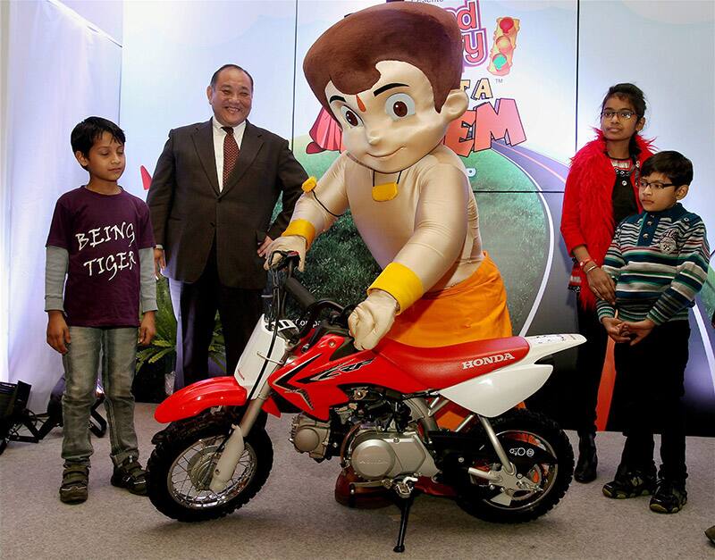 President & CEO,Honda Motorcycle,Keita Muramatsu (2nd L) with Chhota Bheem launch kids Motorcycle in New Delhi.