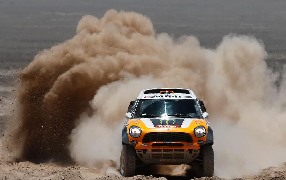 Mini driver Orlando Terranova of Argentina and co-pilot Paulo Fiuza of Portugal drive their Mini during the eight stage of the Dakar Rally between the cities of Salta, Argentina, and Calama, Chile.