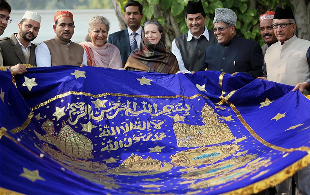 UPA Chairperson Sonia Gandhi holding a `chadar` before sending it for famous Dargah Kaliyar Sharif situated at Kaliyar village of Haridwar, at her residence in New Delhi.