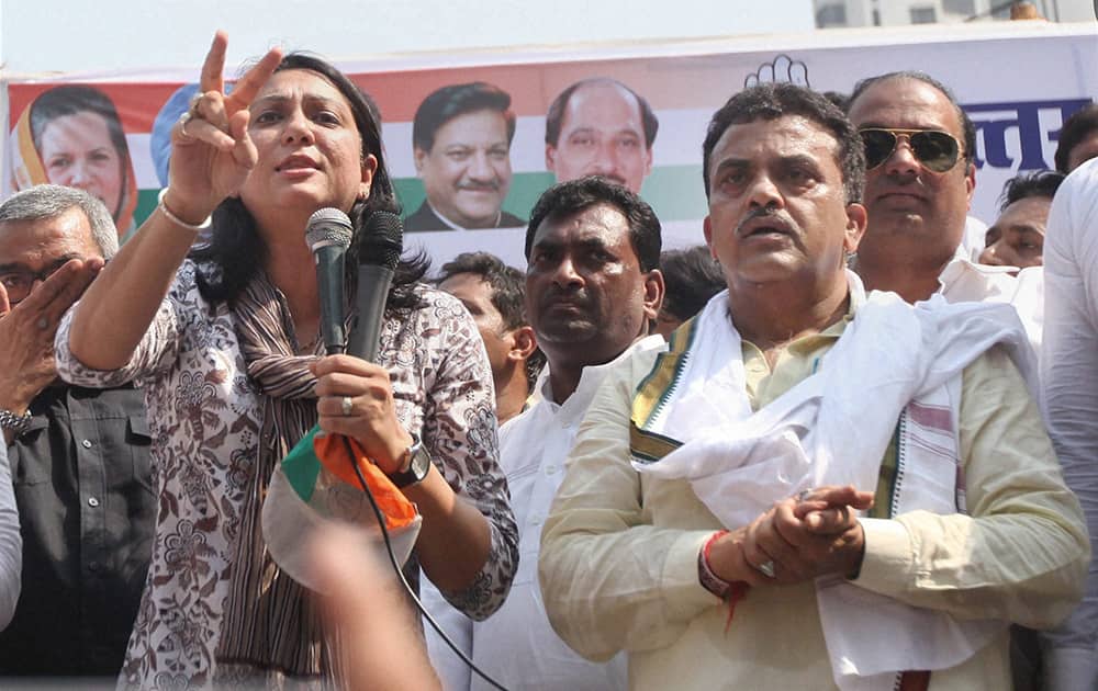 Congress MPs Priya Dutt and Sanjay Nirupam lead a protest outside the Reliance Energy office in Kandivali, Mumbai on Monday seeking reduction in power tariffs in the metropolis.
