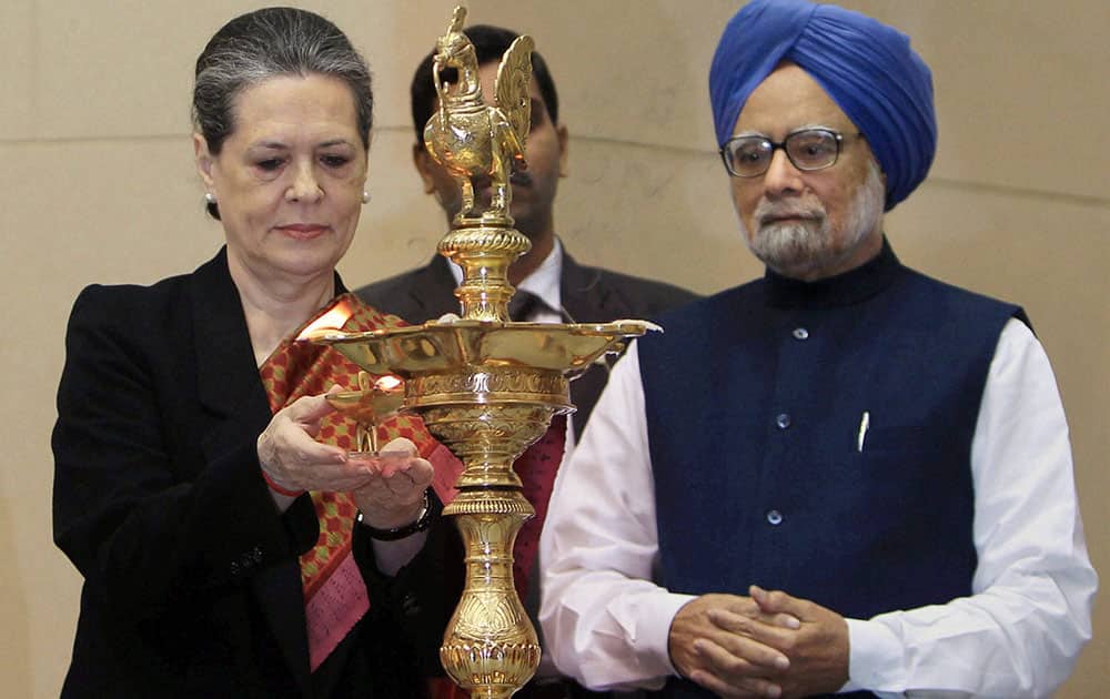 Prime Minister Manmohan Singh with UPA Chairperson Sonia Gandhi lighting the lamp at the closing ceremony of the commemoration of the 150th Birth Anniversary of Swami Vivekananda, in New Delhi.
