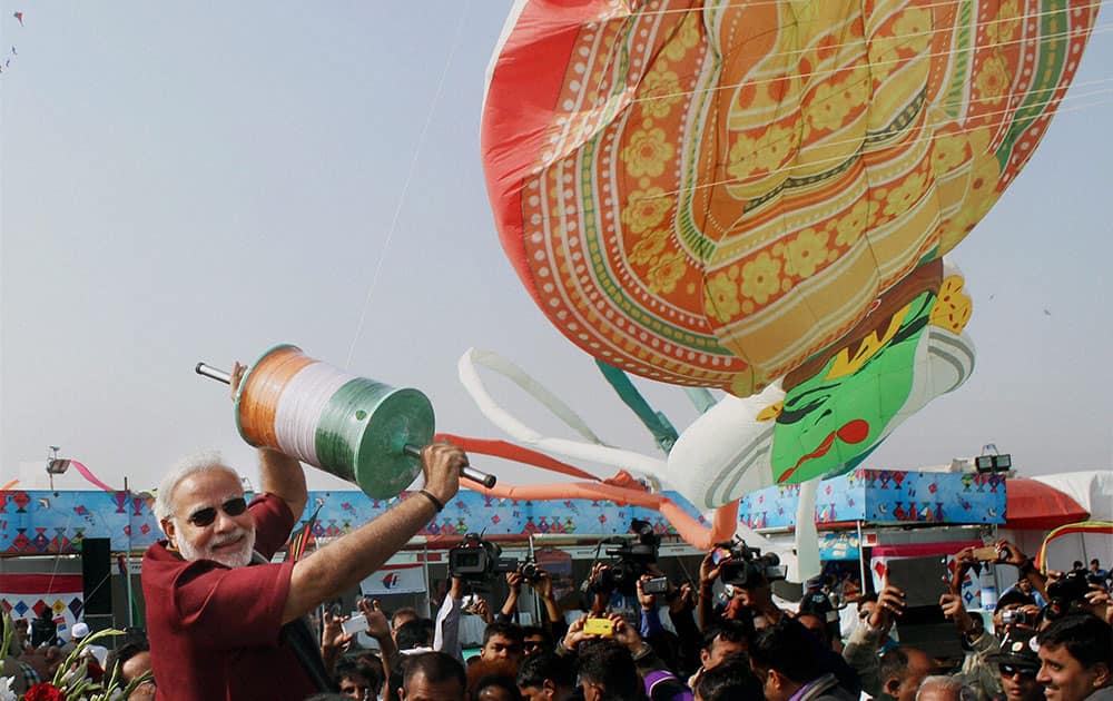 BJP`s PM candidate and Gujarat Chief Minister Narendra Modi flies a kite during the 26th International kite festival in Ahmedabad.