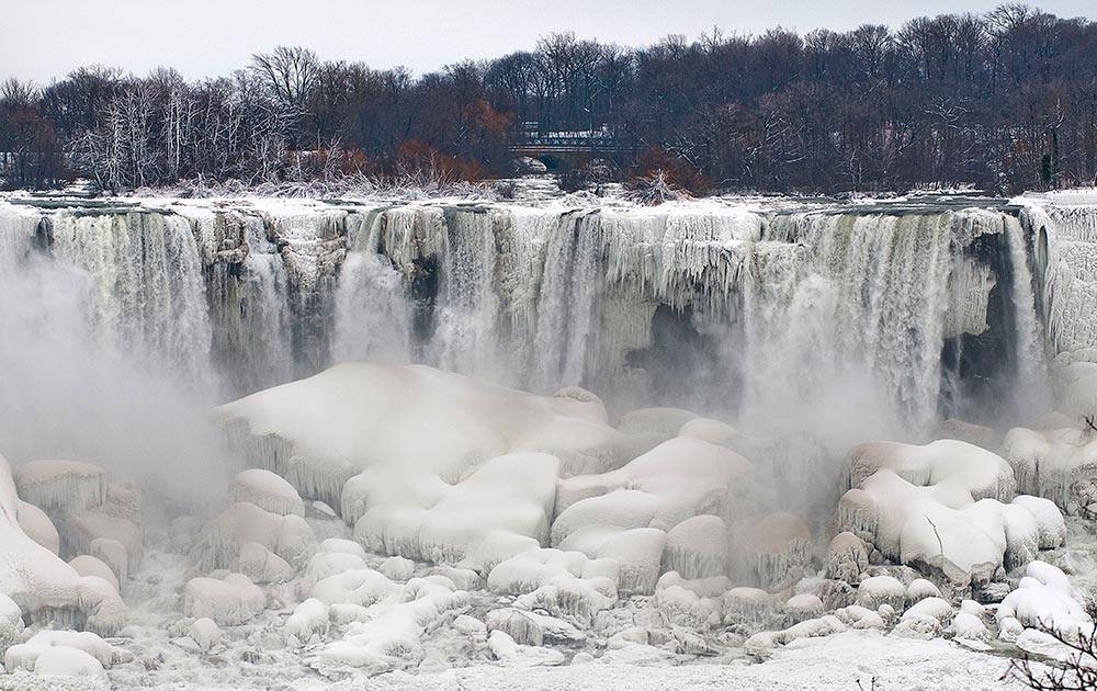 Ice forms along the areas of Niagara Falls and Niagara Falls State Park in Niagara Falls, N.Y., photographed from Niagara Falls Ontario, Canada.