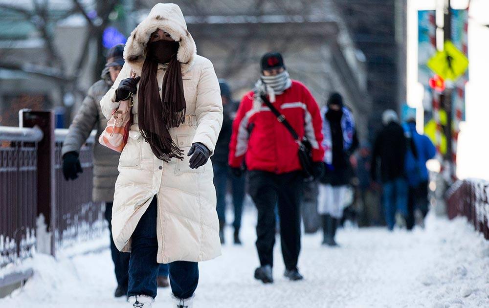 Commuters depart from Union Station with wind chills nearing minus 30 Fahrenheit, in downtown Chicago.