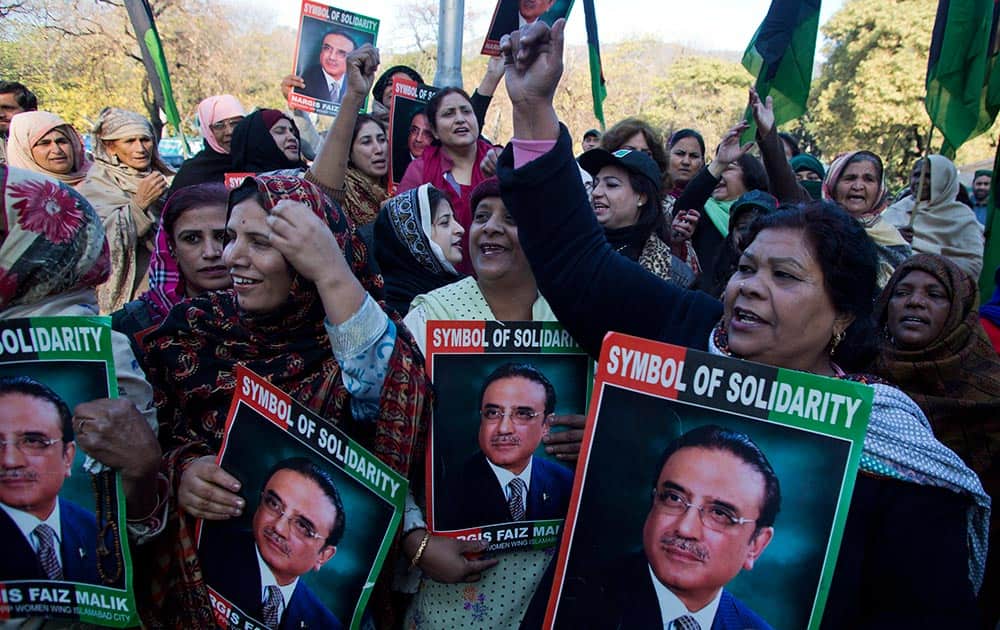 Supporters of Pakistan`s People Party chant slogans in favor of their leader and former Pakistan President Asif Ali Zardari, outside a court in Islamabad, Pakistan.
