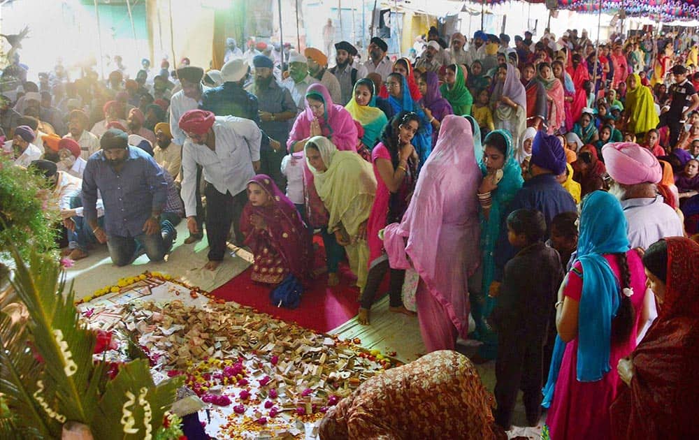 Sikh devotees praying on the occasion of 348th Birth anniversary of 10th Sikh Guru, Sri Guru Gobind Singh ji at Gurudwara Saheb, Gowliguda in Hyderabad.