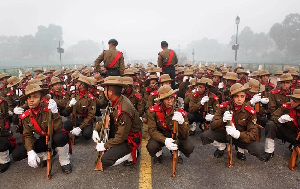 Indian army soldiers wait for their turn for rehearsal for the upcoming Republic Day parade, in New Delhi.