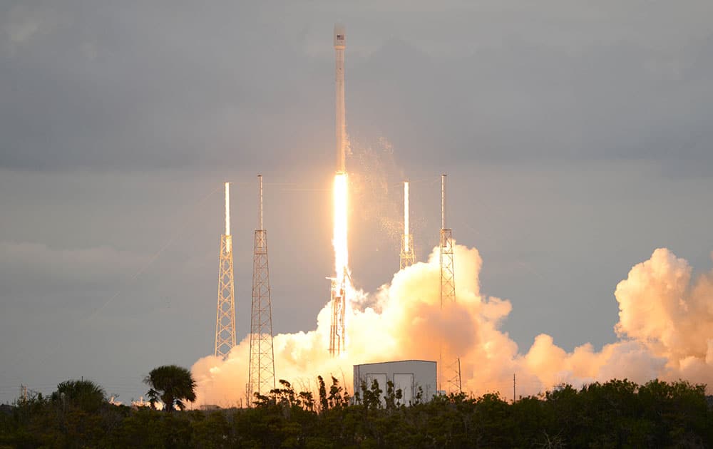 A SpaceX Falcon 9 rocket lifts off from Cape Canaveral Air Force Station. The rocket is carrying the THAICOM 6 telecommunications satellite.
