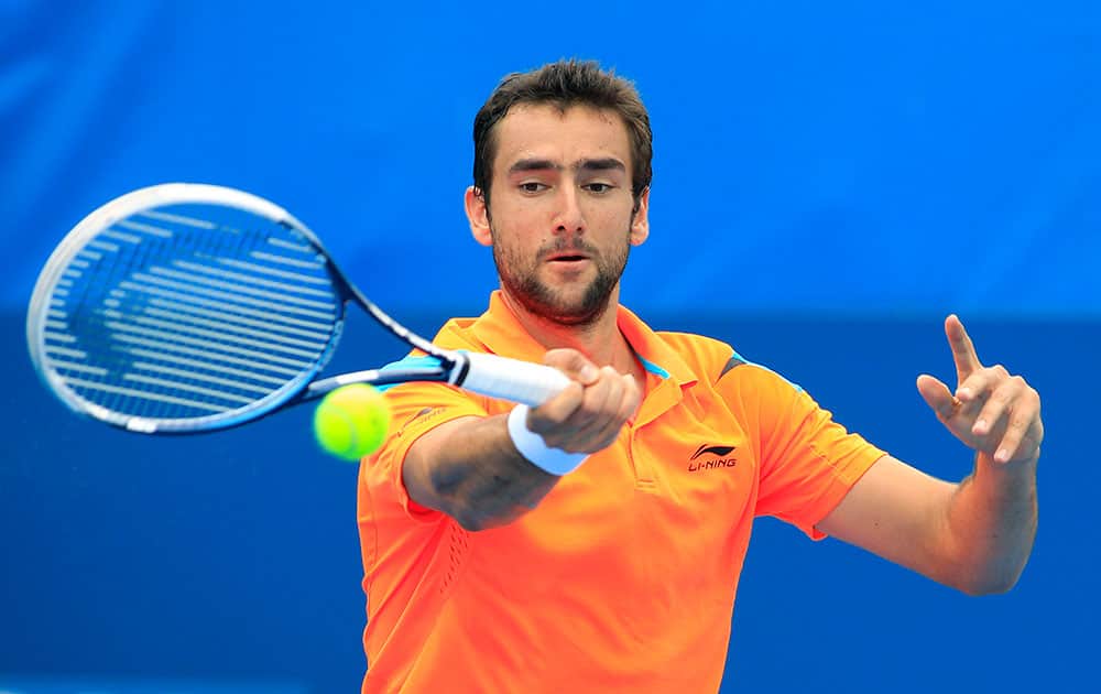 Marin Cilic of Croatia hits a forehand to Jan-Lennard Struff of Germany during their men`s singles match at the Sydney International tennis tournament.
