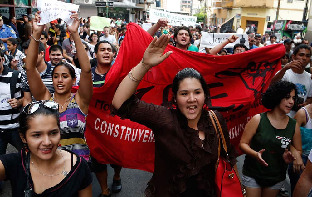 University students take to the streets in protest against a price hike in public transportation, in Asuncion, Paraguay.