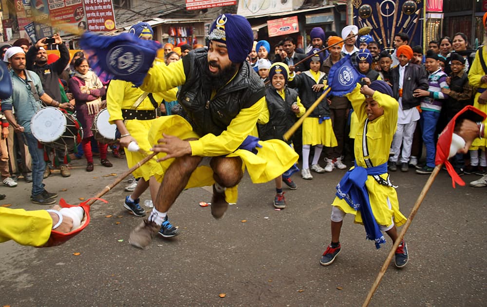 Sikhs perform the gatka, or Sikh martial arts, during a religious procession ahead of the birth anniversary of Guru Gobind Singh in Amritsar.