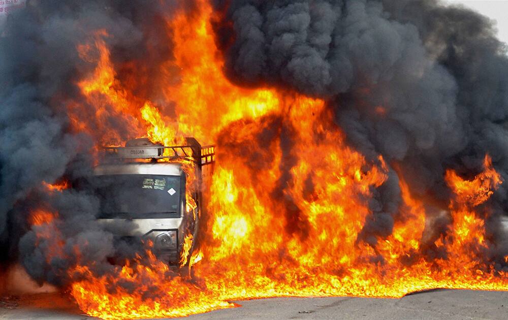 Flames rising out of a luggage mini van, after it caught fire at Rajeev Gandhi Chowk in Faridabad.