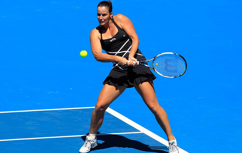 Jarmila Gajdosova of Australia hits a backhand to Lauren Davis of the U.S. during their women`s singles match at the Sydney International tennis tournament in Sydney, Australia.