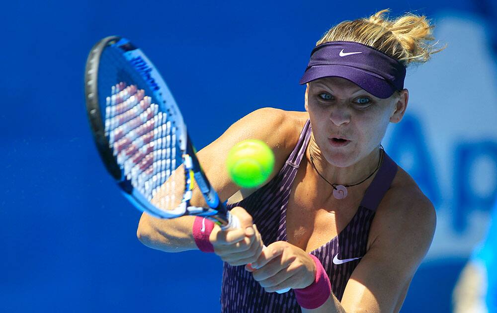 Lucie Safarova of the Czech Republic hits a backhand to Francesca Schiavone of Italy during their women`s singles match at the Sydney International tennis tournament.