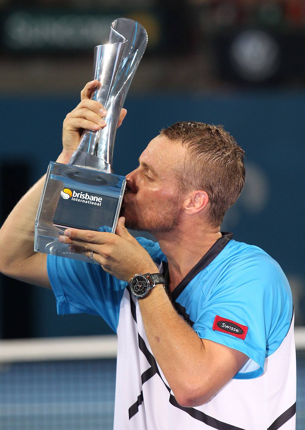 Lleyton Hewitt of Australia kisses his trophy after winning the men`s final match 6-1, 4-6, 6-3 against Roger Federer of Switzerland during the Brisbane International tennis tournament.