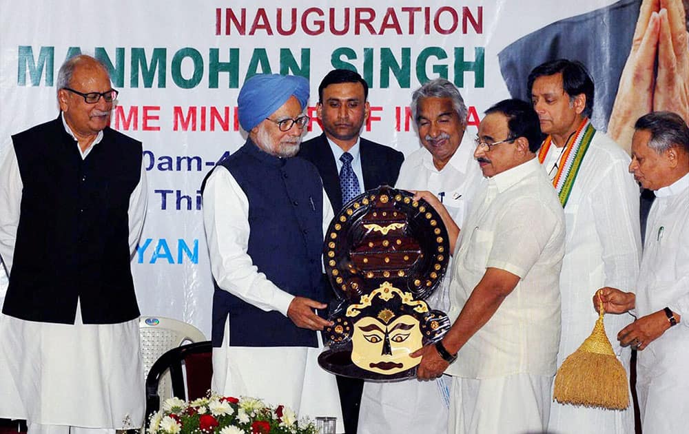 Prime Minister Manmohan Singh receiving a memento from Kerala Education Minister P K Abdu Rabb at a function in Thiruvananthapuram.