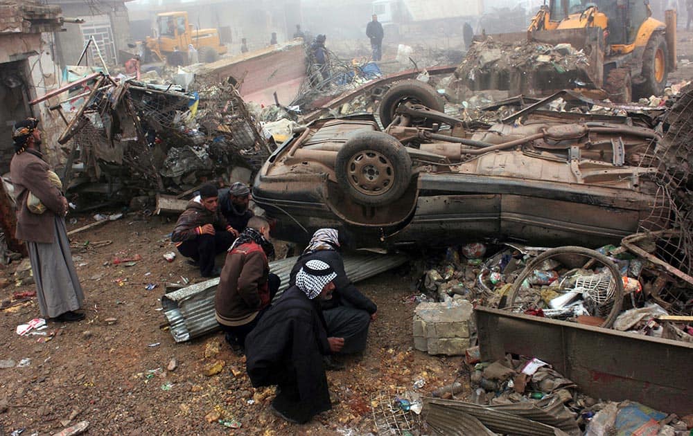 Civilians inspect the aftermath of a massive bomb attack in Balad Ruz, 45 miles (70 kilometers) northeast of Baghdad, Iraq.