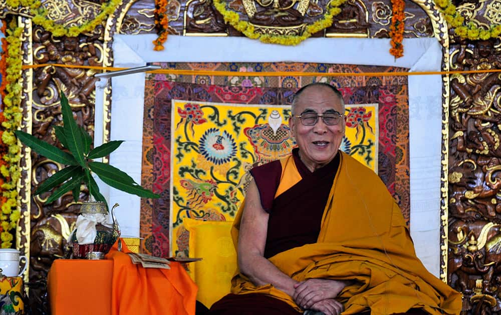Tibetan spiritual leader the Dalai Lama laughs as he delivers the Jangchup Lamrim teachings at the Sera Monastery, Bylakuppe, 135 miles west of Bangalore.