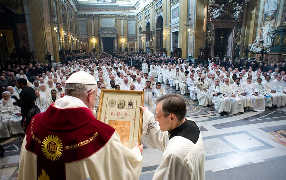 Pope Francis celebrates a mass with the Jesuits on the occasion of the order`s titular feast, in Rome`s Jesus` Church.