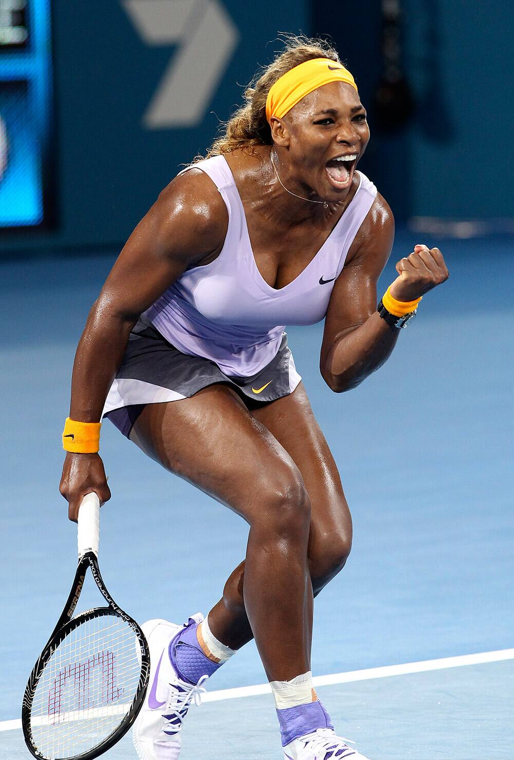Serena Williams of the US celebrates winning a point against Maria Sharapova of Russia in their semifinal match during the Brisbane International tennis tournament in Brisbane, Australia.