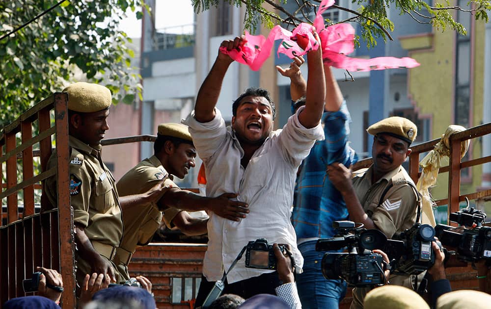 Police detain Telangana student activists, demanding for a separate Telangana state, as they shout slogans against Seemandhra Members of Parliament who went on hunger strike in protest against the proposed bifurcation of the state of Andhra Pradesh, during a protest in Hyderabad.