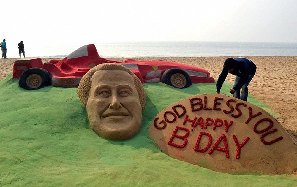 Sand artist Sudarsan Pattnaik created a sand sculpture with a message for Formula One legend Michael Schumacher`s speedy recovery and his 45th birthday at Puri beach.