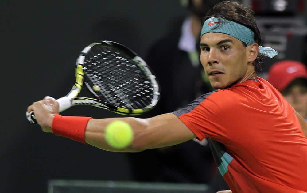 Spain`s Rafael Nadal returns the ball to Ernests Gulbis of Latvia during the quarter final at ExxonMobil Qatar ATP Open Tennis tournament at the Khalifa Tennis Complex in Doha, Qatar.