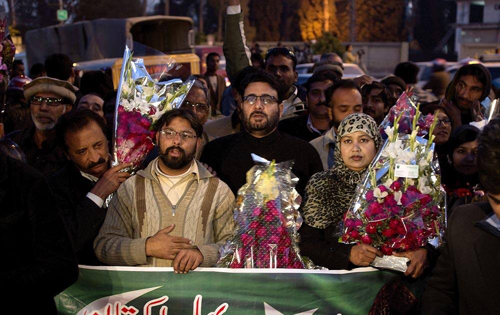 Supporters of Pakistan`s former president and military ruler Pervez Musharraf gather outside a military hospital where Musharraf is admitted in Rawalpindi, Pakistan.