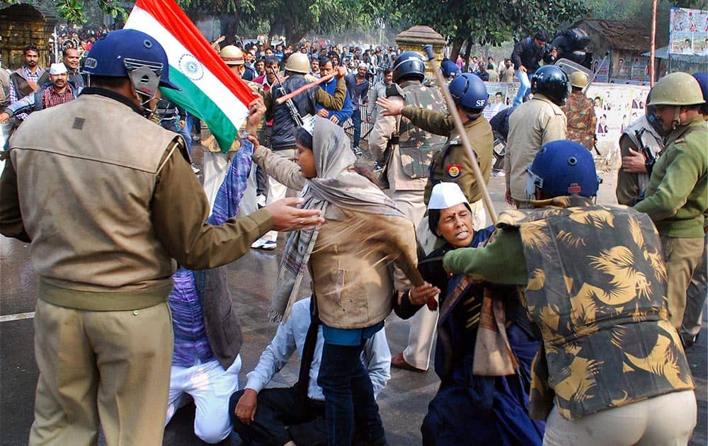 Policeman resorting to lathicharge on students and AAP members during their protest against corruption in Uttar Pradesh Public Service Commission, in Allahabad.