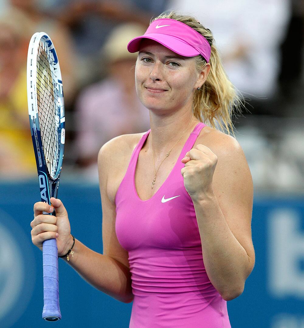 Maria Sharapova of Russia celebrates after defeating Kaia Kanepi of Estonia during the Brisbane International tennis tournament.
