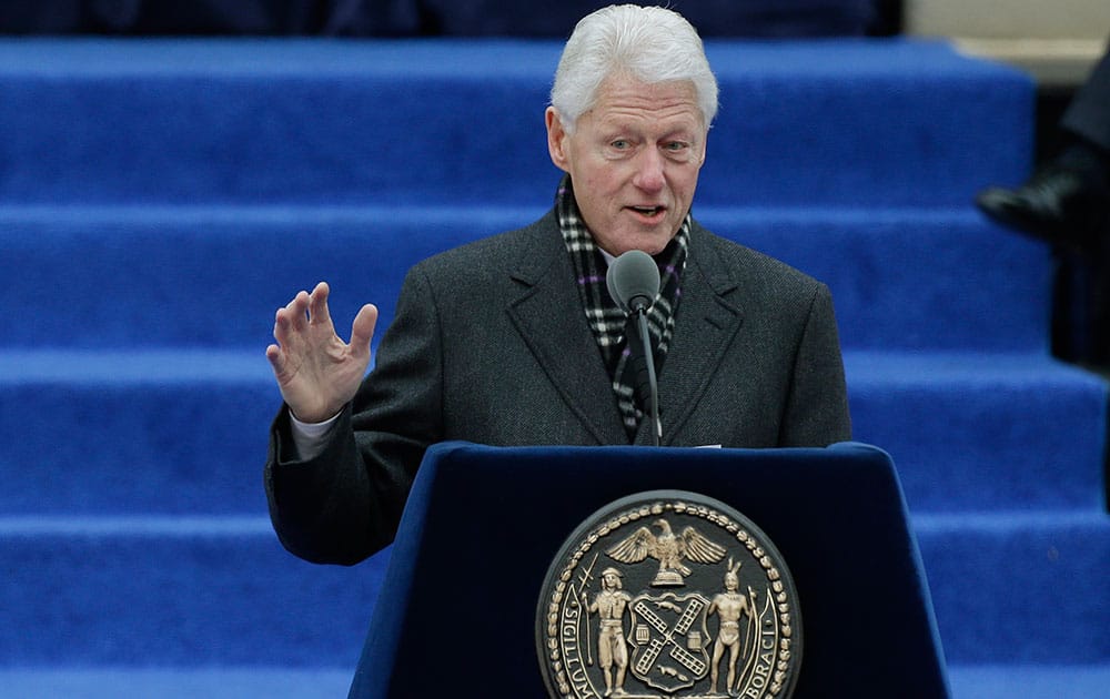 Former President Bill Clinton speaks before administering the oath of office for New York Mayor-elect Bill de Blasio in on the steps of City Hall, in New York.