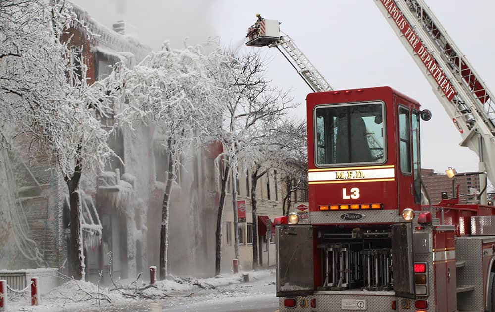 Crews battle a Minneapolis apartment fire. The billowing fire engulfed a three-story building, sending 13 people to hospitals with injuries ranging from burns to trauma associated with falls.