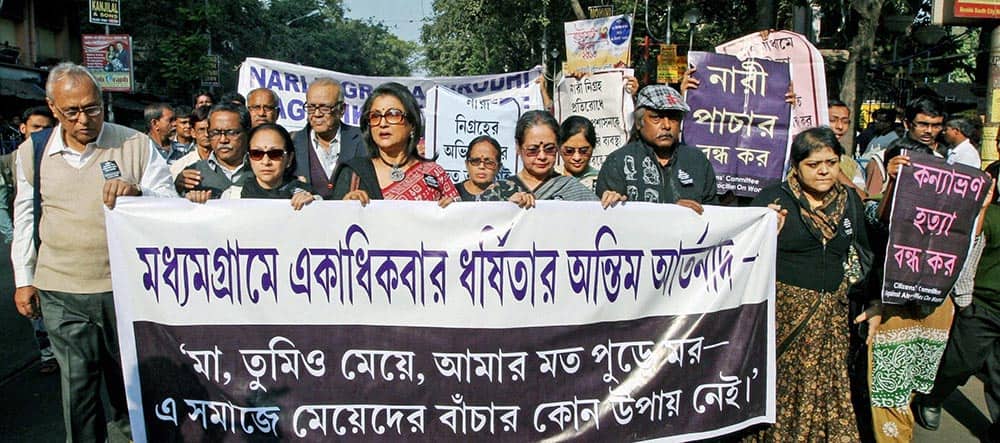 Eminent Film director Aparna Sen and Painter Samir Aich and Intellectuals take part in a protest rally against rape of a 16 years old girl, in Kolkata.