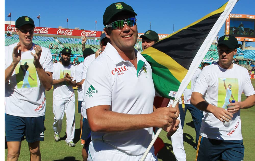 Jacques Kallis and teammates walk around the ground after he retired from Test cricket at end of the fifth and final day of their cricket test match against India at Kingsmead stadium, Durban, South Africa.