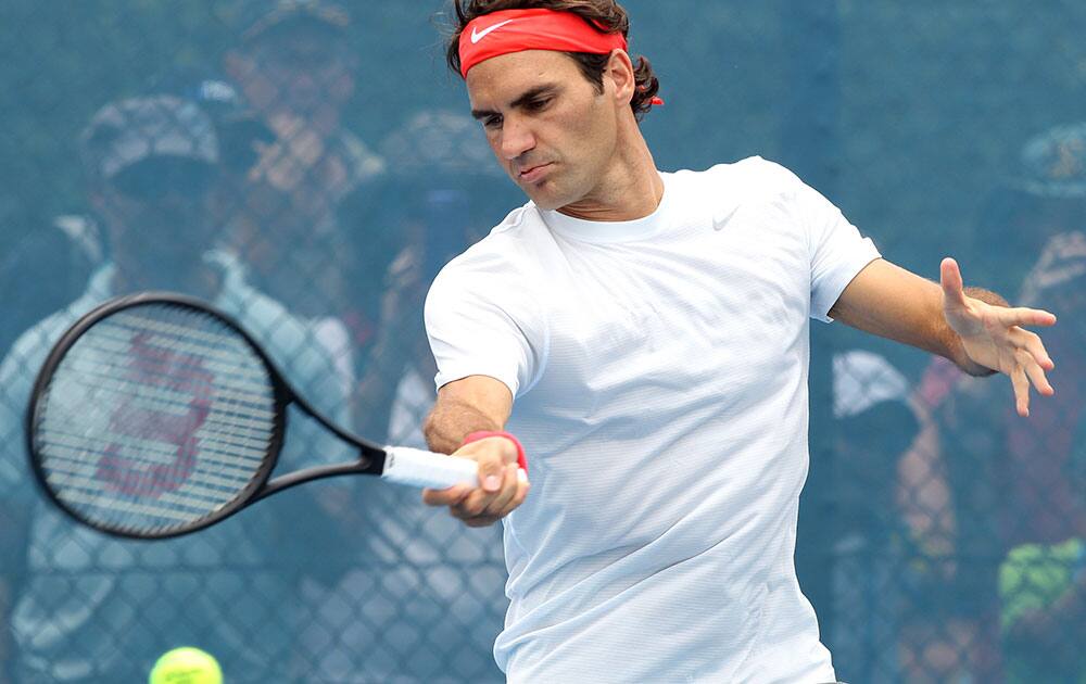 Roger Federer of Switzerland hits the ball in his training session during the Brisbane International tennis tournament.