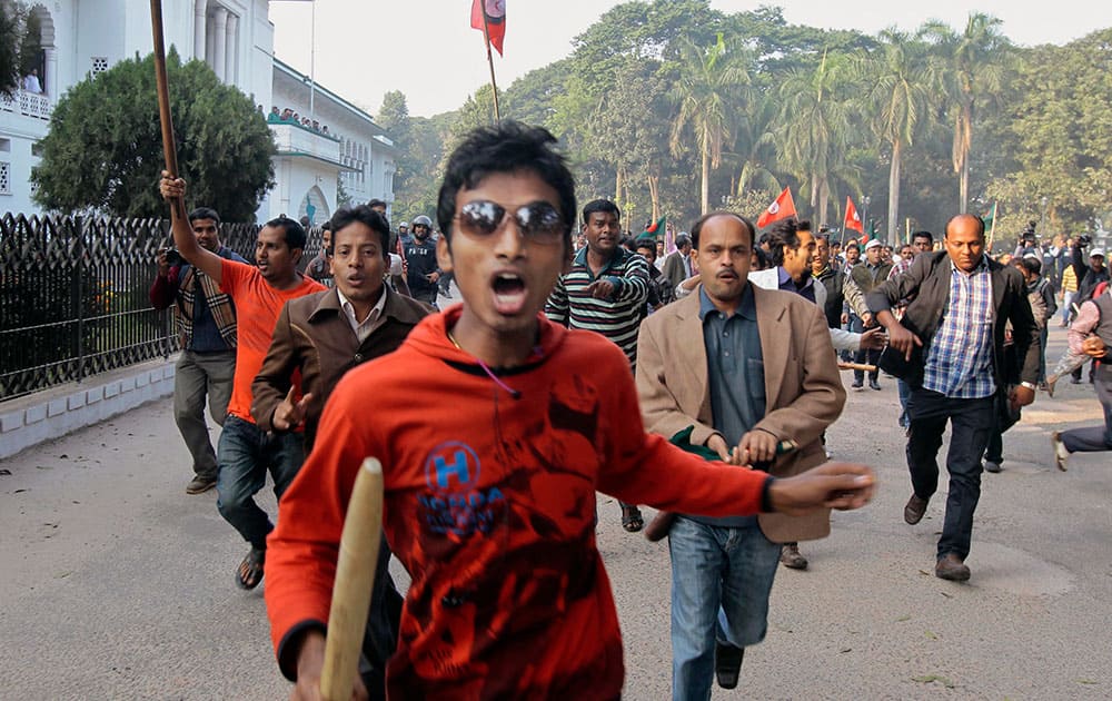 Supporter of the ruling Bangladesh Awami League chase supporters of the main opposition Bangladesh Nationalist Party (BNP) during a protest by opposition activists in Dhaka, Bangladesh.