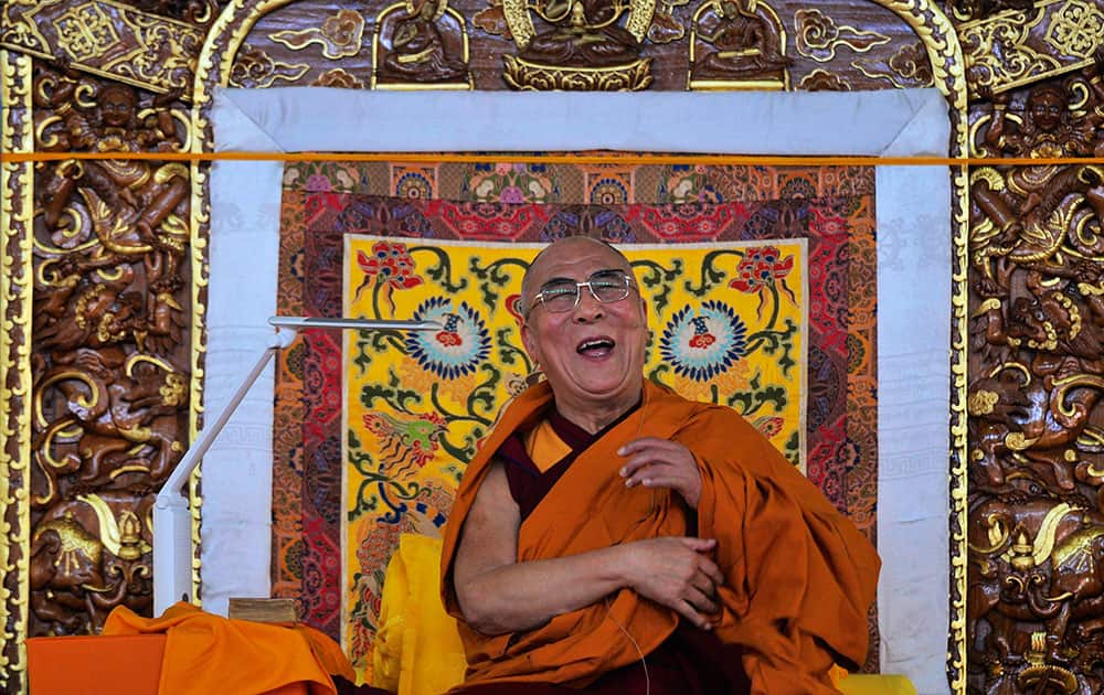 Tibetan spiritual leader the Dalai Lama laughs as he delivers the Jangchup Lamrim teachings in Bylakuppe, about 135 miles west of Bangalore, India.