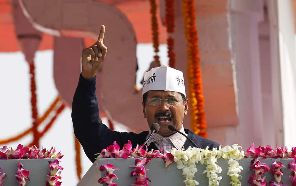 Aam Aadmi Party, or Common Man`s Party, leader Arvind Kejriwal speaks to the crowd after being sworn-in as chief minister of Delhi in New Delhi.
