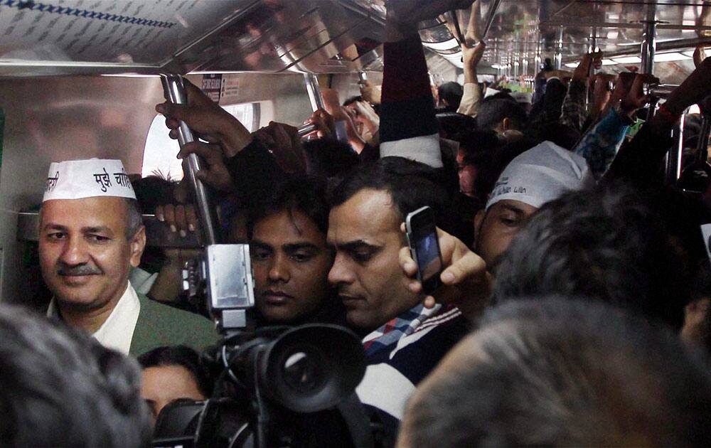 Aam Aadmi Party leader Manish Sisodia at the Koshambi metro station enroute Ramlila maidan for swearing-in ceremony.