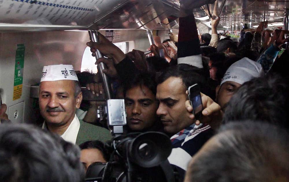 Aam Aadmi Party leader Manish Sisodia at the Koshambi metro station enroute Ramlila maidan for swearing-in ceremony.