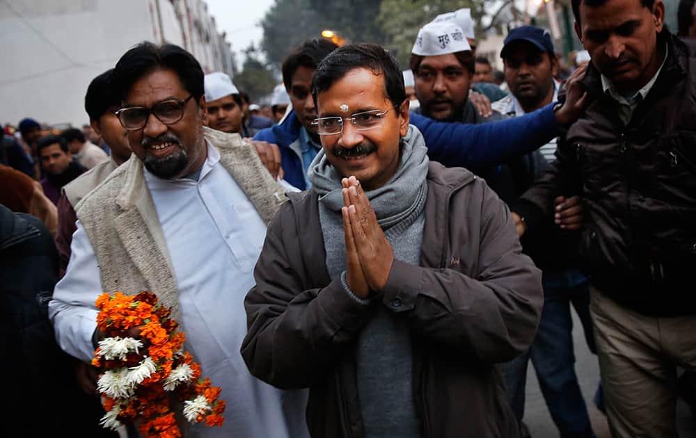 Aam Aadmi Party, or Common Man`s Party, leader Arvind Kejriwal greets supporters during a public meeting in New Delhi.
