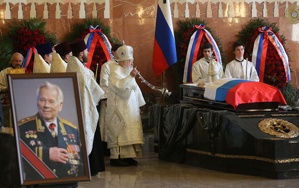 Russian Orthodox Church Metropolitan Yuvenaly conducts a service during a memorial service for Russian firearm designer Mikhail Kalashnikov in Moscow, Russia.