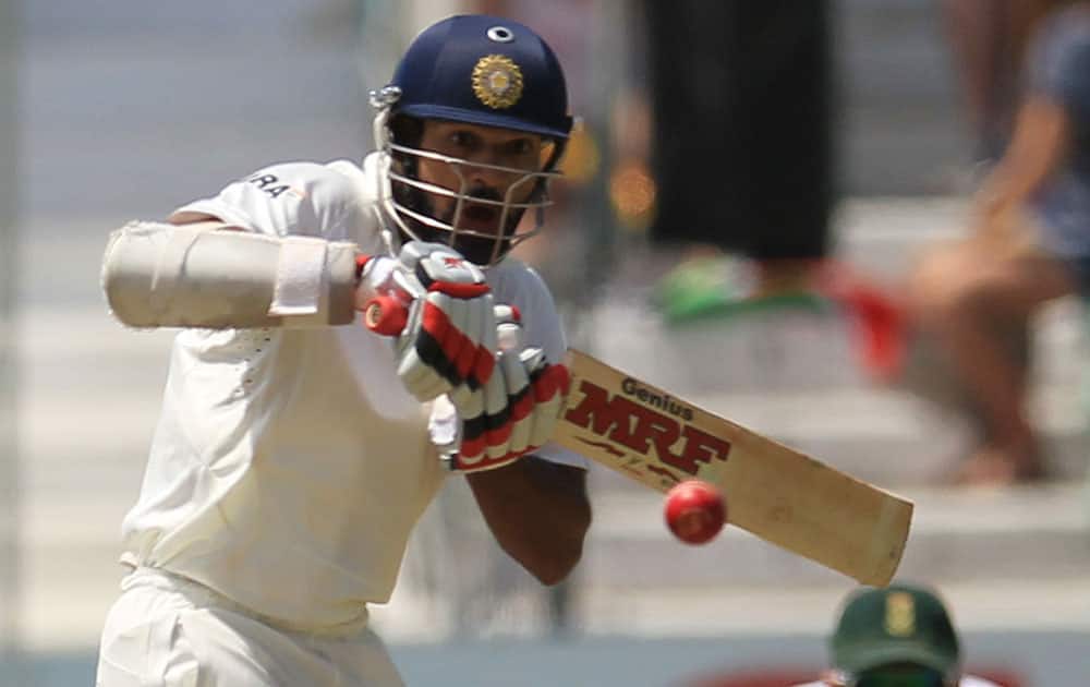 India`s batsman Shikhar Dhawan plays a shot during first day of their cricket test match against South Africa at Kingsmead stadium, Durban, South Africa.