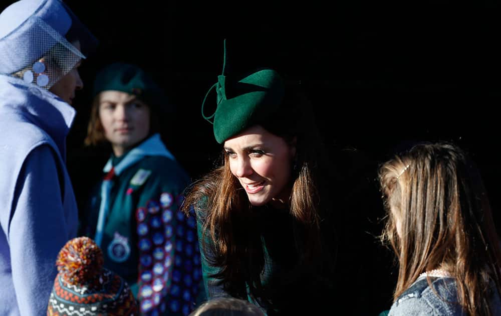 Britain`s Duchess of Cambridge talks to children after she and other members of the royal family attended a Christmas Day Service at St. Mary`s church on the grounds of Sandringham Estate, the Queen Elizabeth`s retreat, in Norfolk, England.