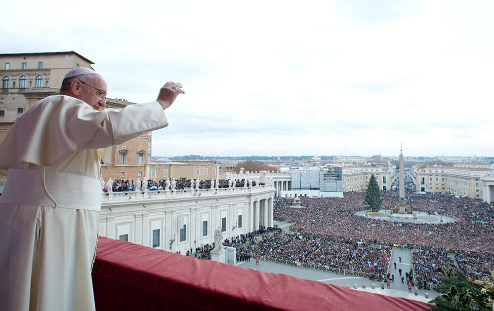 Pope Francis delivers his `Urbi et Orbi` (to the City and to the World) message from the central balcony of St. Peter`s Basilica at the Vatican.